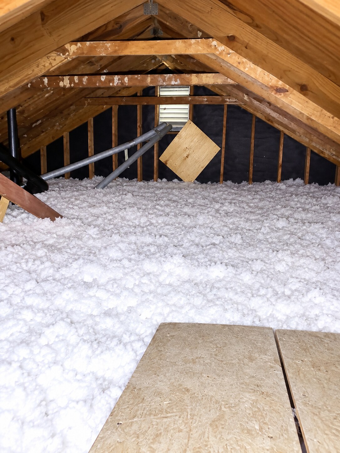 Finished Hampton Roads attic after insulation replacement with an even layer of blown-in insulation