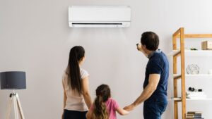 family using air conditioner with efficiency