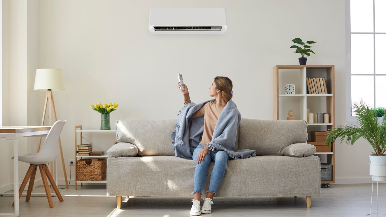 woman resting and enjoying air conditioner