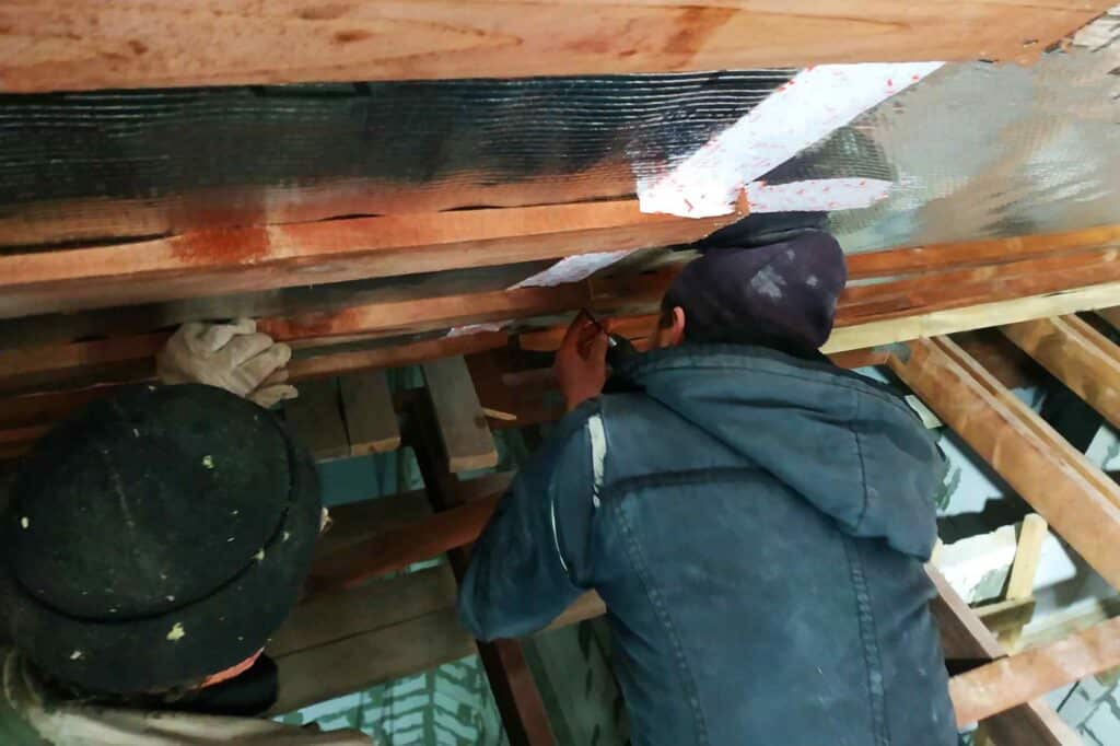 the masters team installs the roof of the house